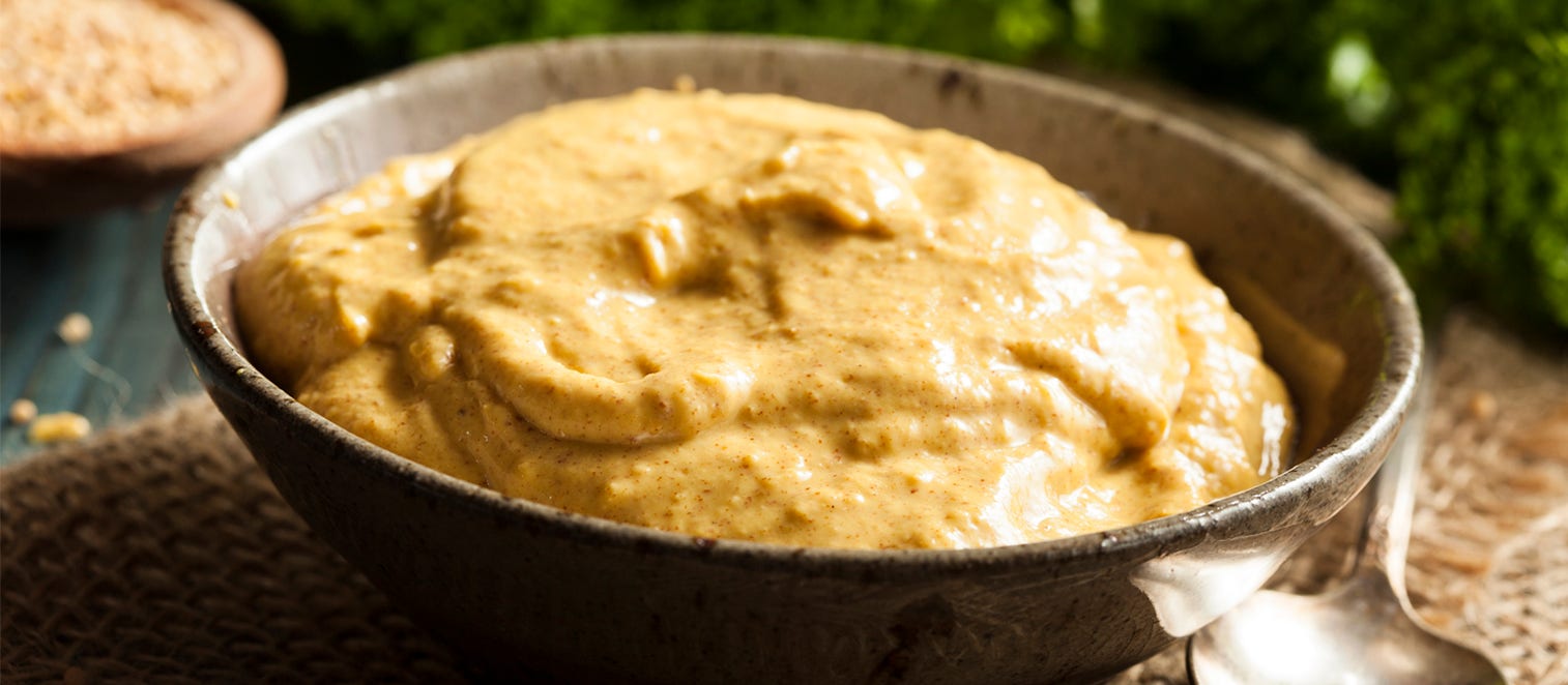 Homemade Spicy Mustard Sauce on a Background