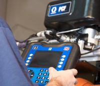 Man operating adhesive flow controller