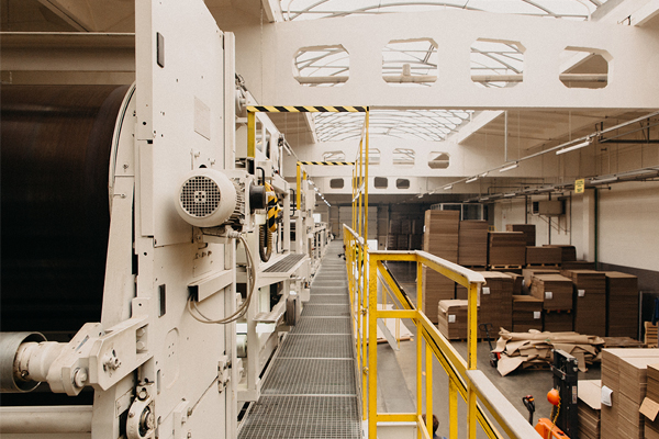 An image of a production line in carton manufacturing using Graco equipment