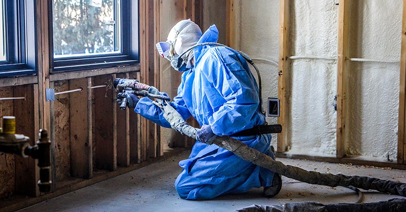 a man spraying insulation with a Fusion PC ProConnect